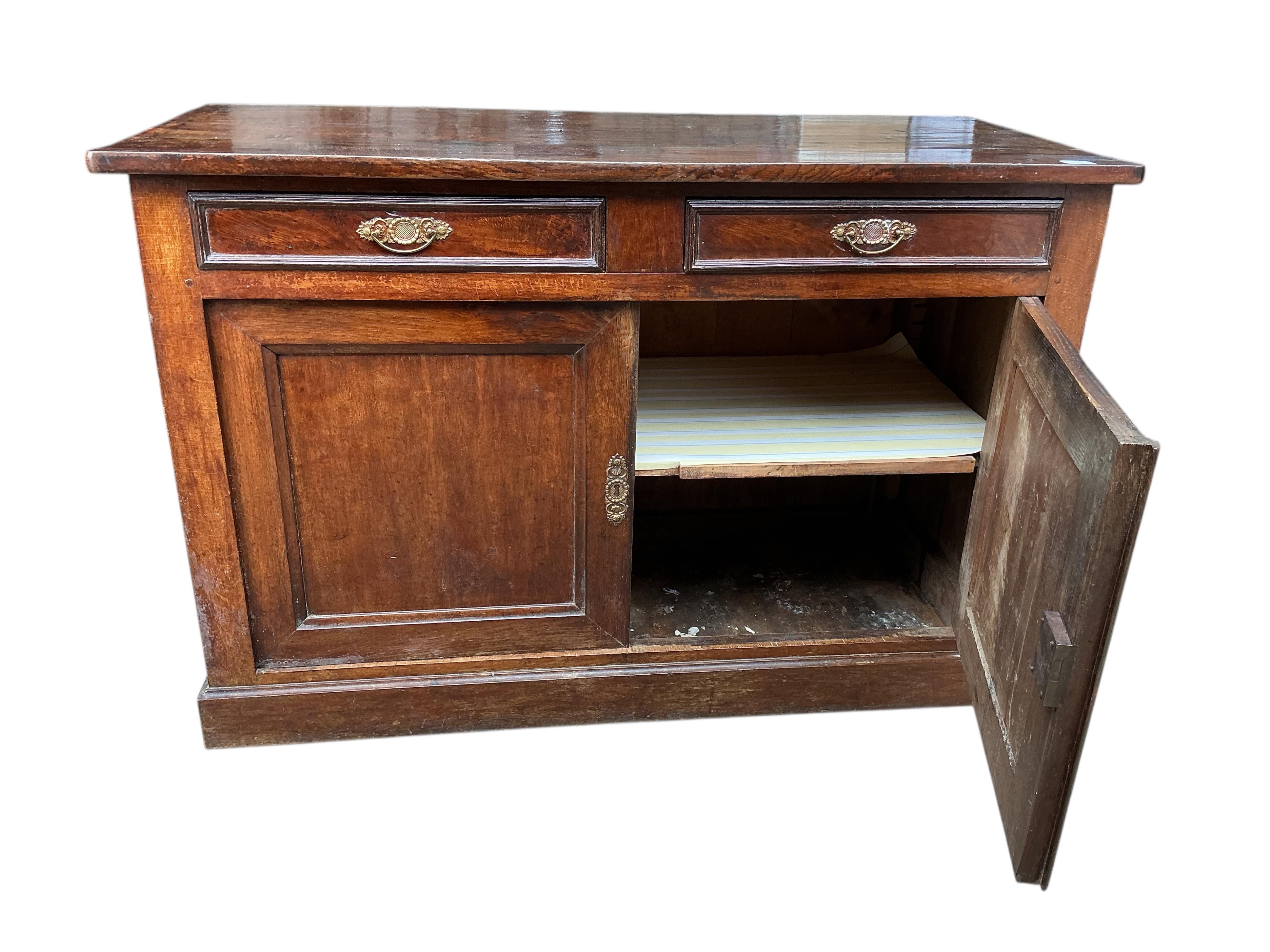 An early 19th century French oak and fruit wood buffet, width 140cm, depth 62cm, height 92cm